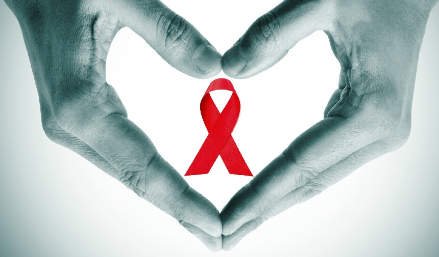 Laço vermelho da campanha Dezembro Vermelho representando a importância de fazer a palestra DST AIDS nas empresas